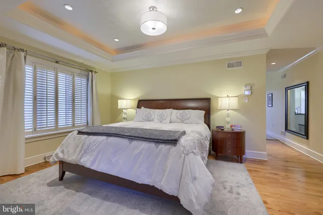 a bathroom with a bathtub sink and mirror
