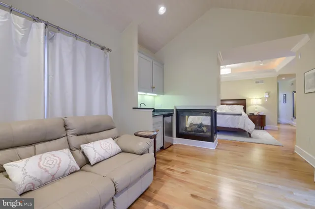 a bathroom with a tub and a mirror