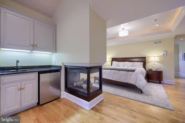 a kitchen with granite countertop a sink and cabinets