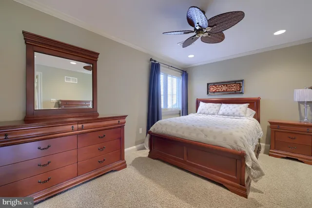 a living room with furniture a lamp and a window
