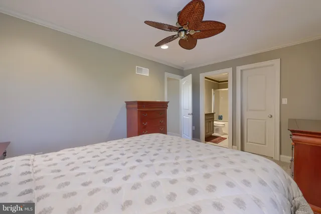 a bathroom with a sink mirror and vanity