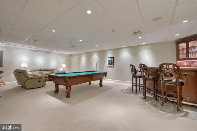 a front view of a house with a yard table and chairs