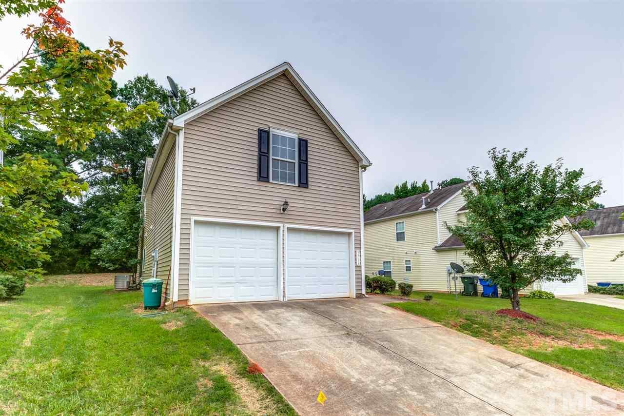 3713 Cyrus Street Raleigh, NC 27610 - Photo 3 of 30 Exterior view of the two car garage