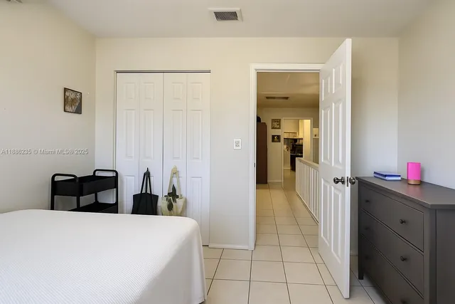 a bedroom with a bed and a cabinets