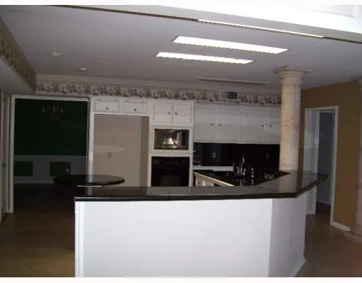 a kitchen with a stove and a microwave