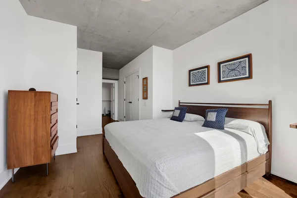 a bed room with a bed and a walk in closet