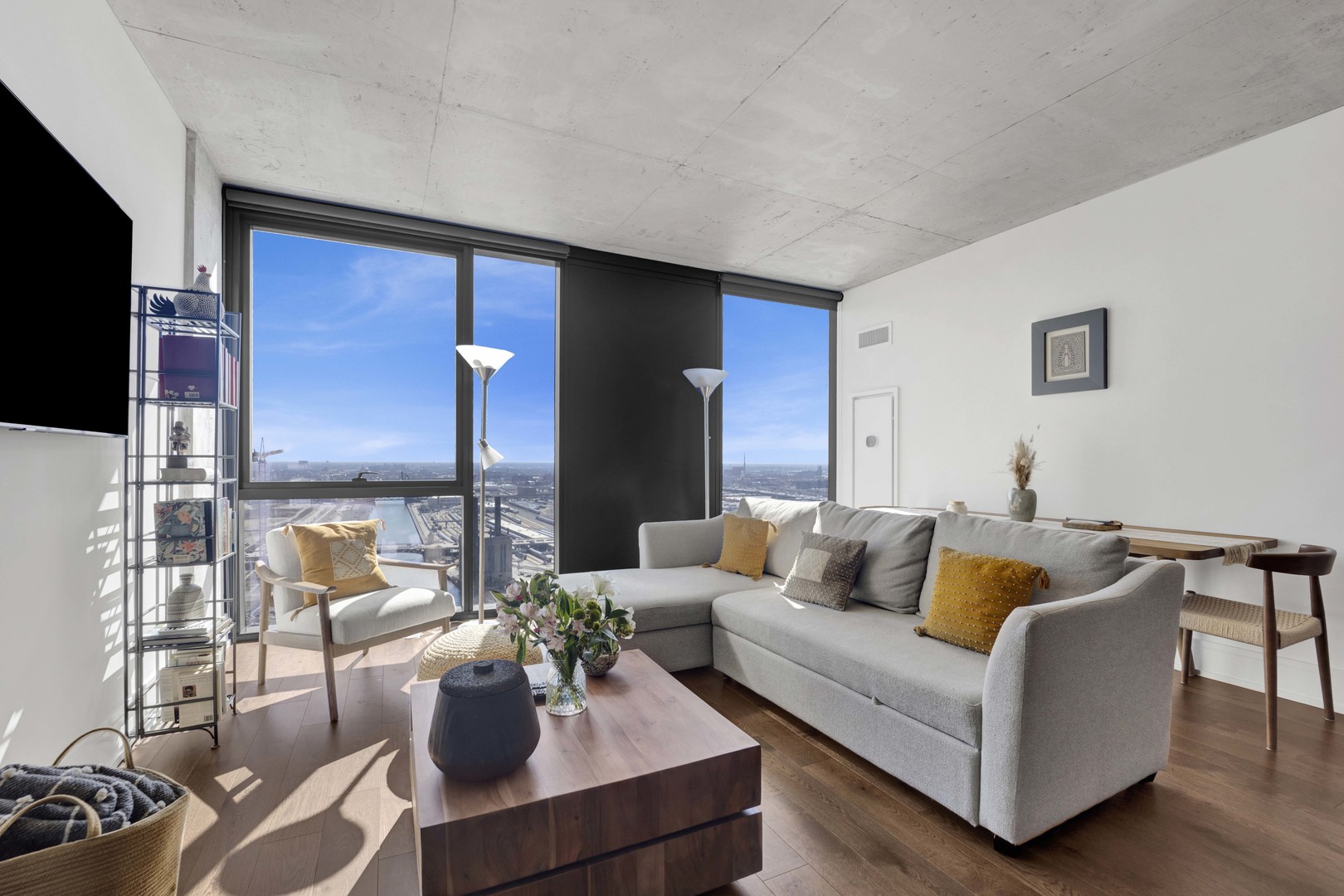 234 West Polk Street, Unit 2903 Chicago, IL 60607 - Photo 2 of 39 a living room with furniture and a flat screen tv
