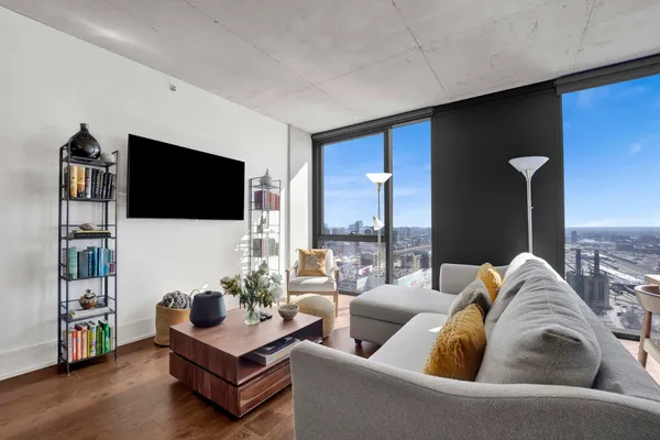 a living room with furniture and a flat screen tv