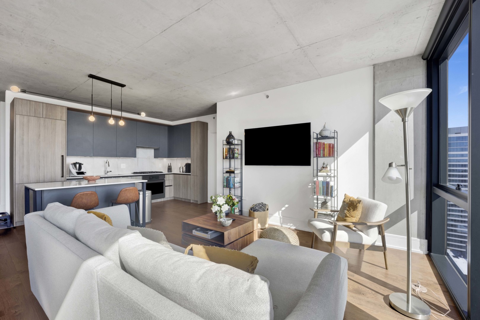 234 West Polk Street, Unit 2903 Chicago, IL 60607 - Photo 5 of 39 a living room with furniture and a flat screen tv