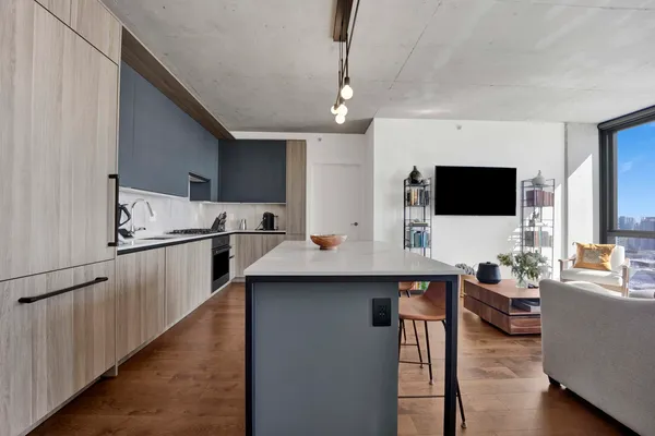 a kitchen with counter top space cabinets and appliances