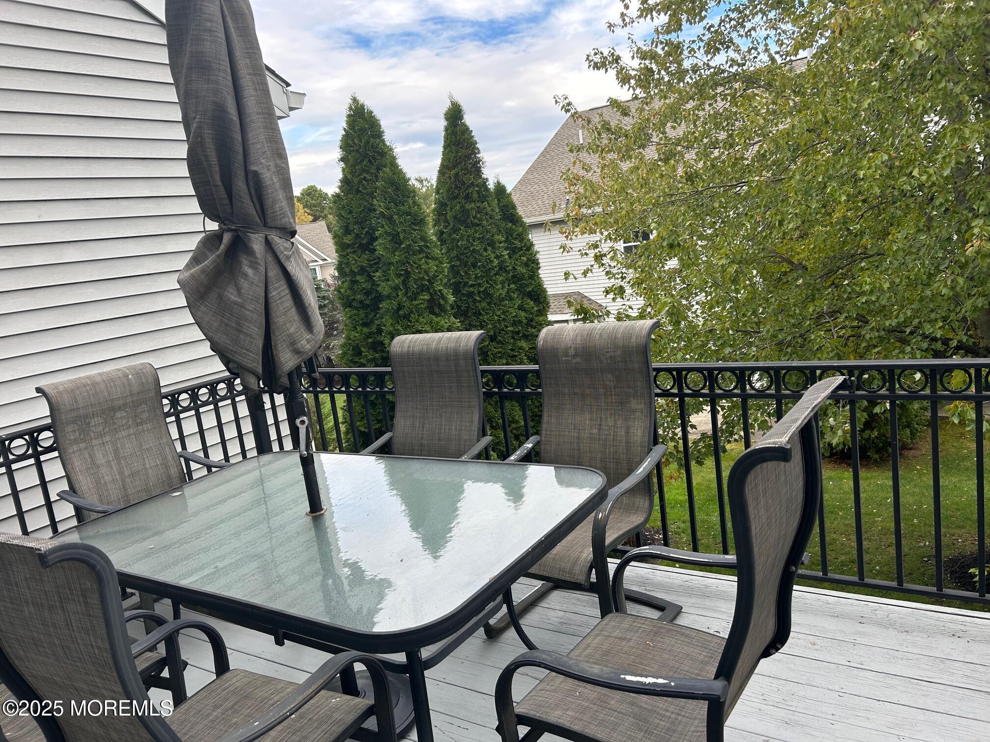 319 Bernard Drive Morganville, NJ 07751 - Photo 11 of 32 a balcony view with couple of chairs