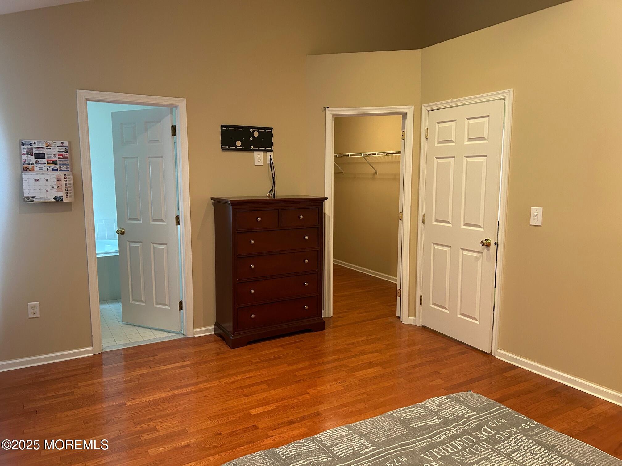319 Bernard Drive Morganville, NJ 07751 - Photo 13 of 32 an empty room with wooden floor and closet