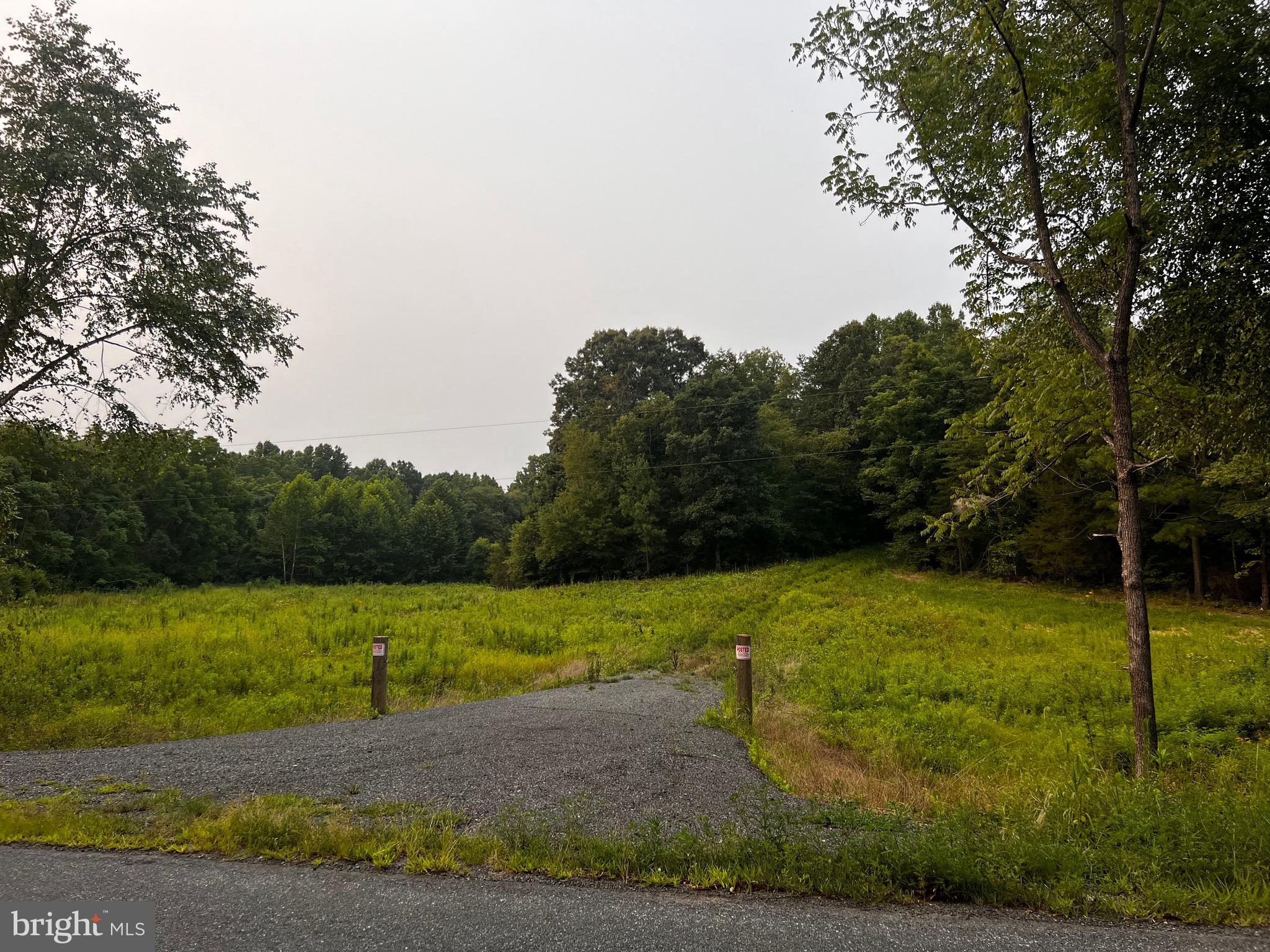 Hunters Ridge Lane Unionville, VA 22567 - Photo 29 of 33 a view of a field with an trees in the background