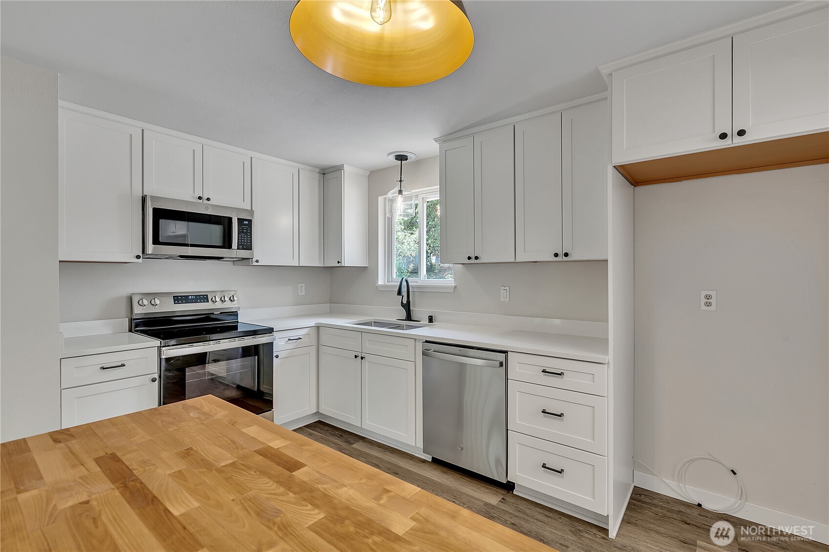 46 Ira Light Street Steilacoom, WA 98388 - Photo 15 of 35 a kitchen with cabinets stainless steel appliances and a sink
