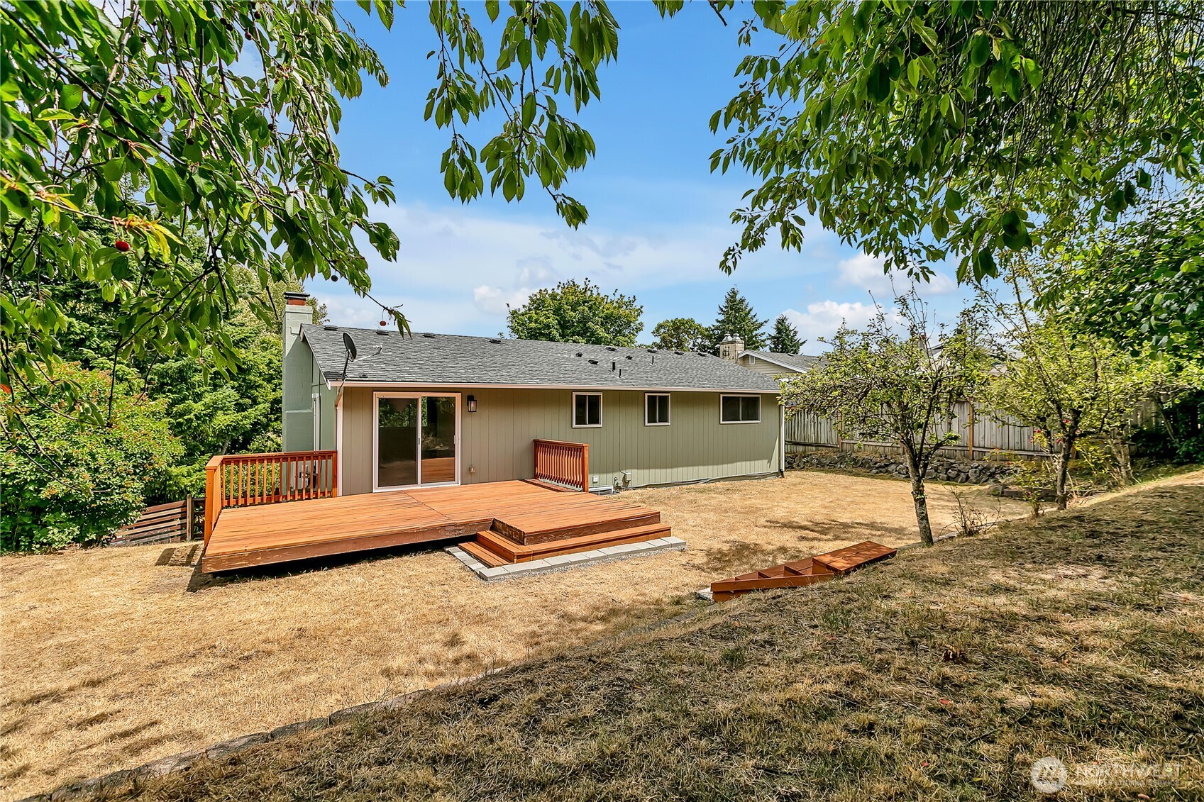 46 Ira Light Street Steilacoom, WA 98388 - Photo 29 of 35 a house with a tree in front of it