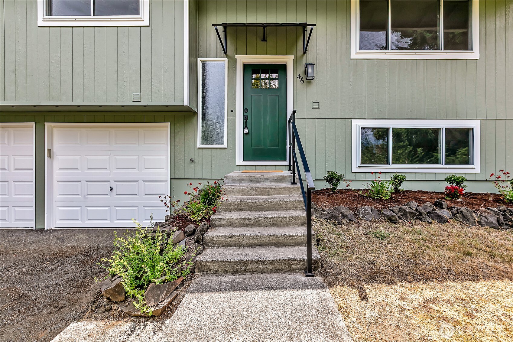 46 Ira Light Street Steilacoom, WA 98388 - Photo 4 of 35 a front view of a house with a garden