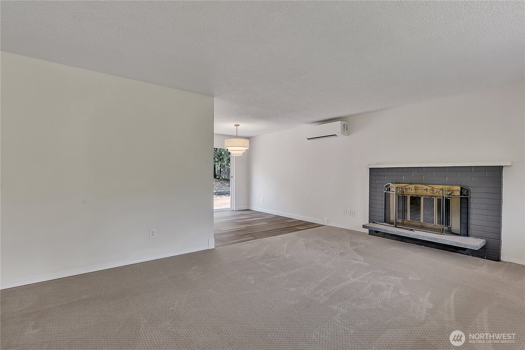 46 Ira Light Street Steilacoom, WA 98388 - Photo 7 of 35 a view of an empty room with a fireplace and a window