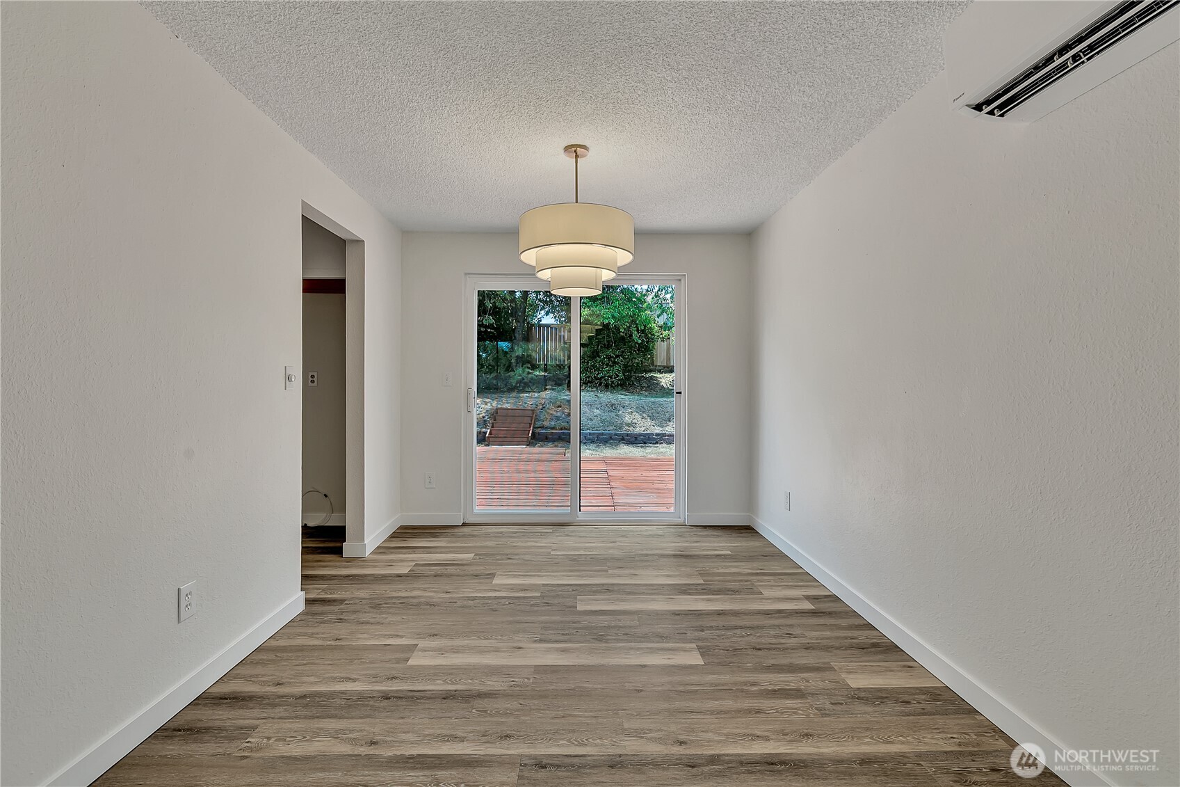 46 Ira Light Street Steilacoom, WA 98388 - Photo 9 of 35 a view of an empty room with wooden floor and a window