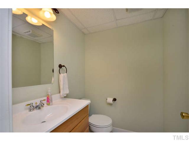 7201 Grist Mill Road Raleigh, NC 27615 - Photo 20 of 25 a bathroom with a sink and a mirror