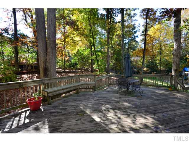 7201 Grist Mill Road Raleigh, NC 27615 - Photo 21 of 25 a view of a bench in a garden