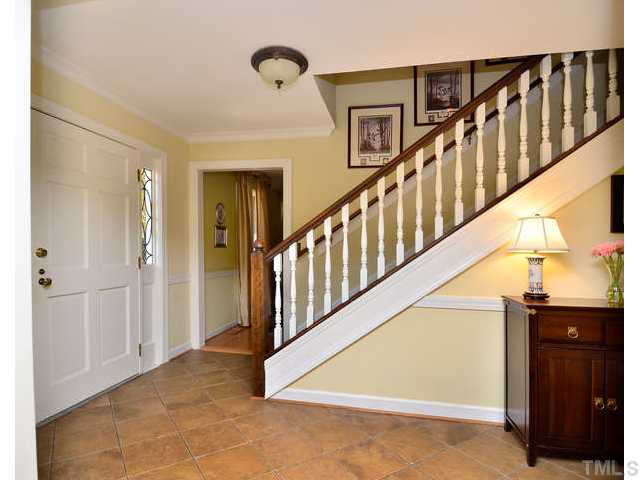 7201 Grist Mill Road Raleigh, NC 27615 - Photo 3 of 25 a view of a hallway with staircase