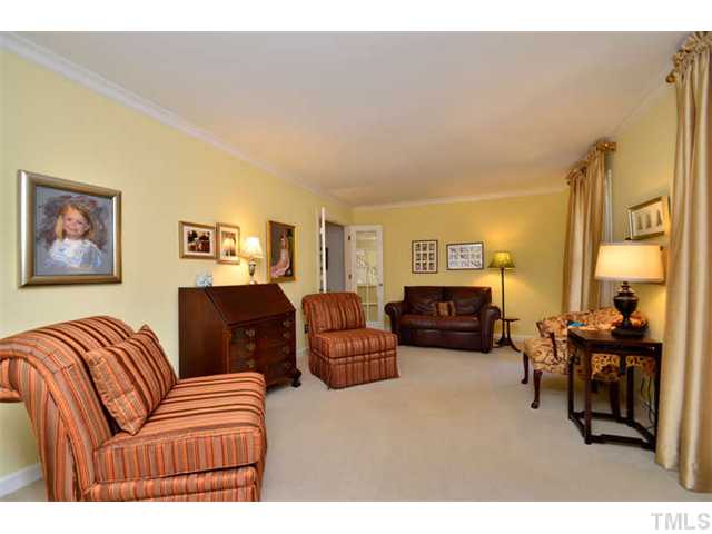 7201 Grist Mill Road Raleigh, NC 27615 - Photo 4 of 25 a living room with furniture a couch and a piano