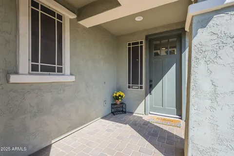 a kitchen with stainless steel appliances granite countertop a stove a sink a oven a dining table and chairs