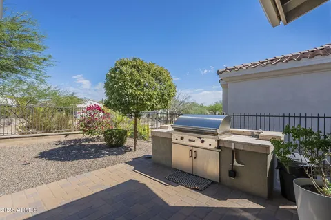 an aerial view of a house with garden space and street view