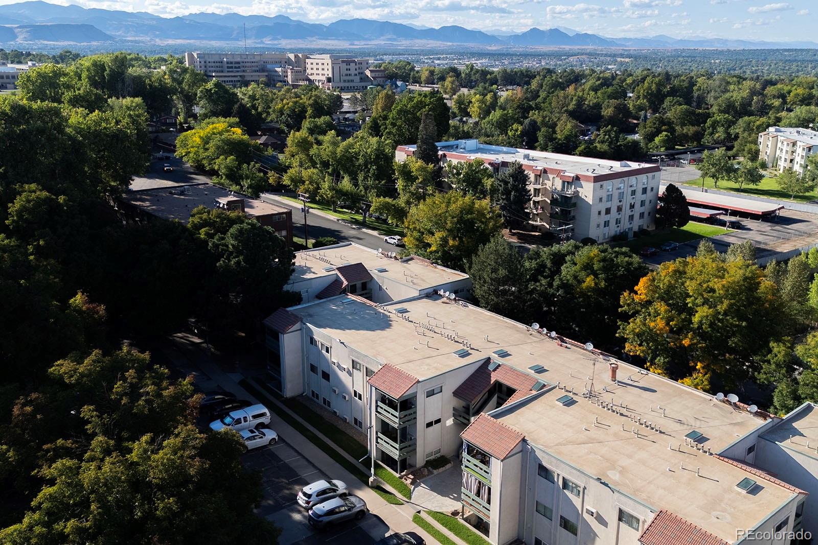 7740 West 35th Avenue, Unit 207 Wheat Ridge, CO 80033 - Photo 17 of 18 an aerial view of a house with a garden