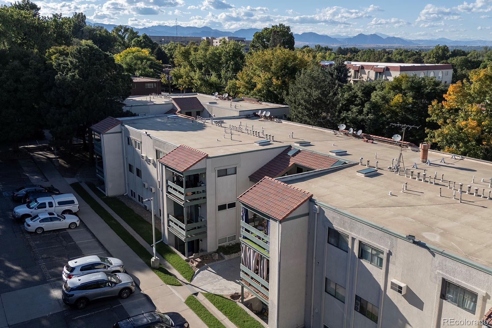 7740 West 35th Avenue, Unit 207 Wheat Ridge, CO 80033 - Photo 18 of 18 an aerial view of a house with a yard