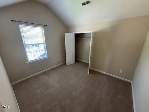 wooden floor in an empty room with a mirror