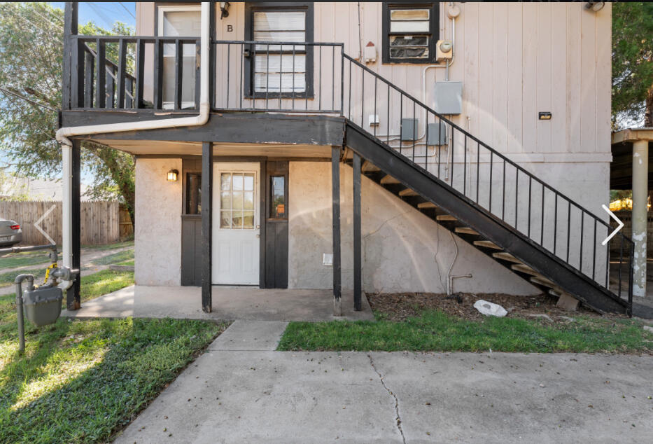 2605 22nd Street, Unit REAR #1 Lubbock, TX 79410 - Photo 1 of 1 a view of a house with a small yard and potted plants