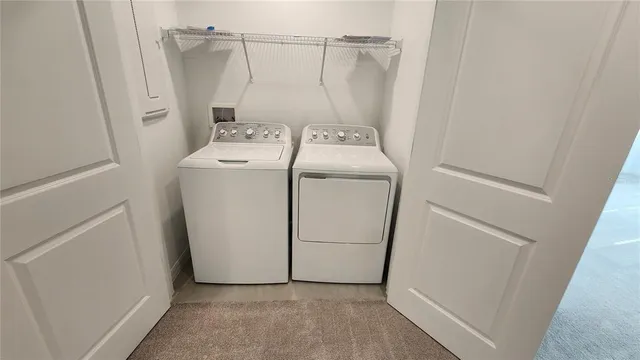 a utility room with dryer and washer