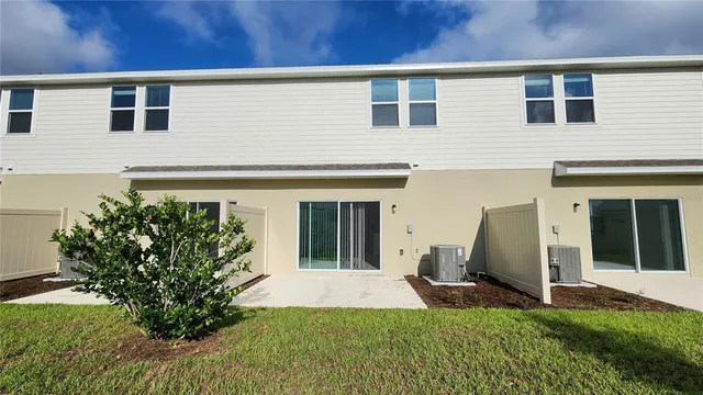 a front view of a house with a yard and a garage
