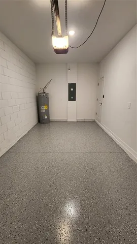 an empty room with a ceiling fan and window