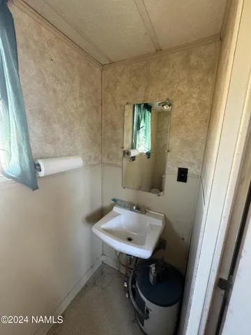 a bathroom with a sink and a toilet