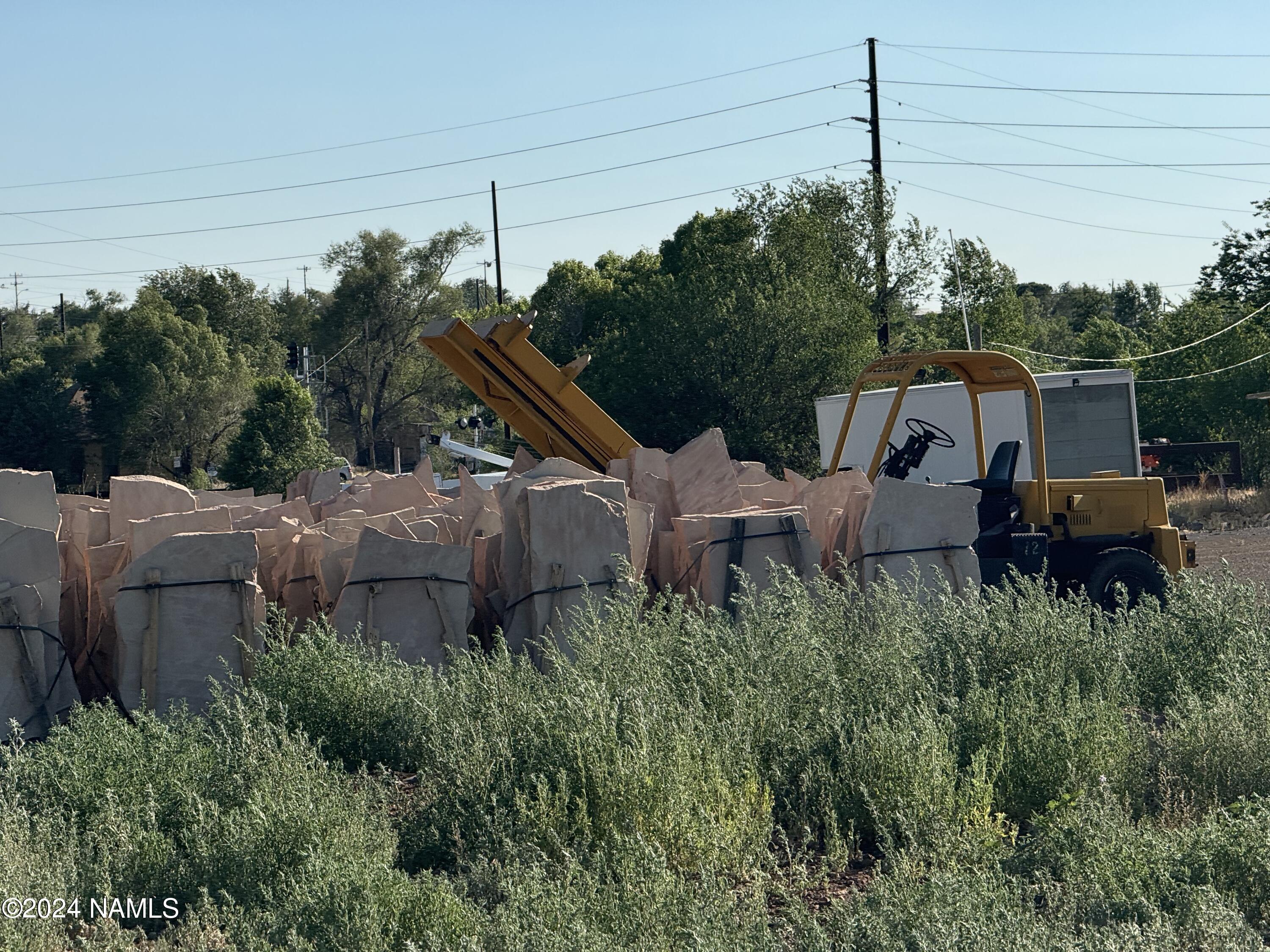 48501 North Double A Rnch Road Williams, AZ 86046 - Photo 33 of 46 a backyard of a house with lots of green space and outdoor seating
