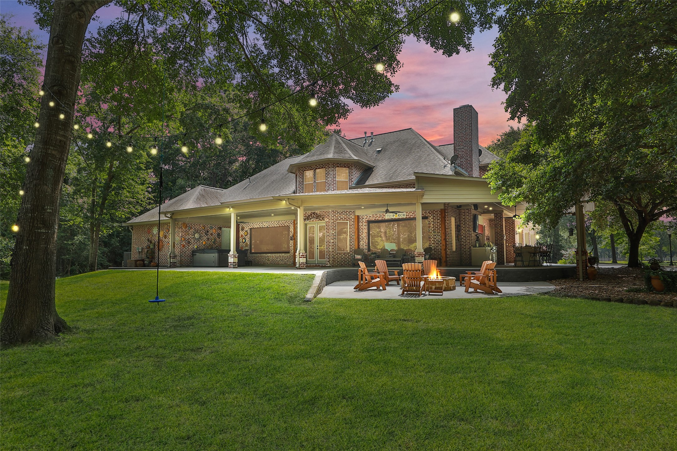 12126 Zion Road Tomball, TX 77375 - Photo 12 of 45 a front view of a house with a yard porch and outdoor seating