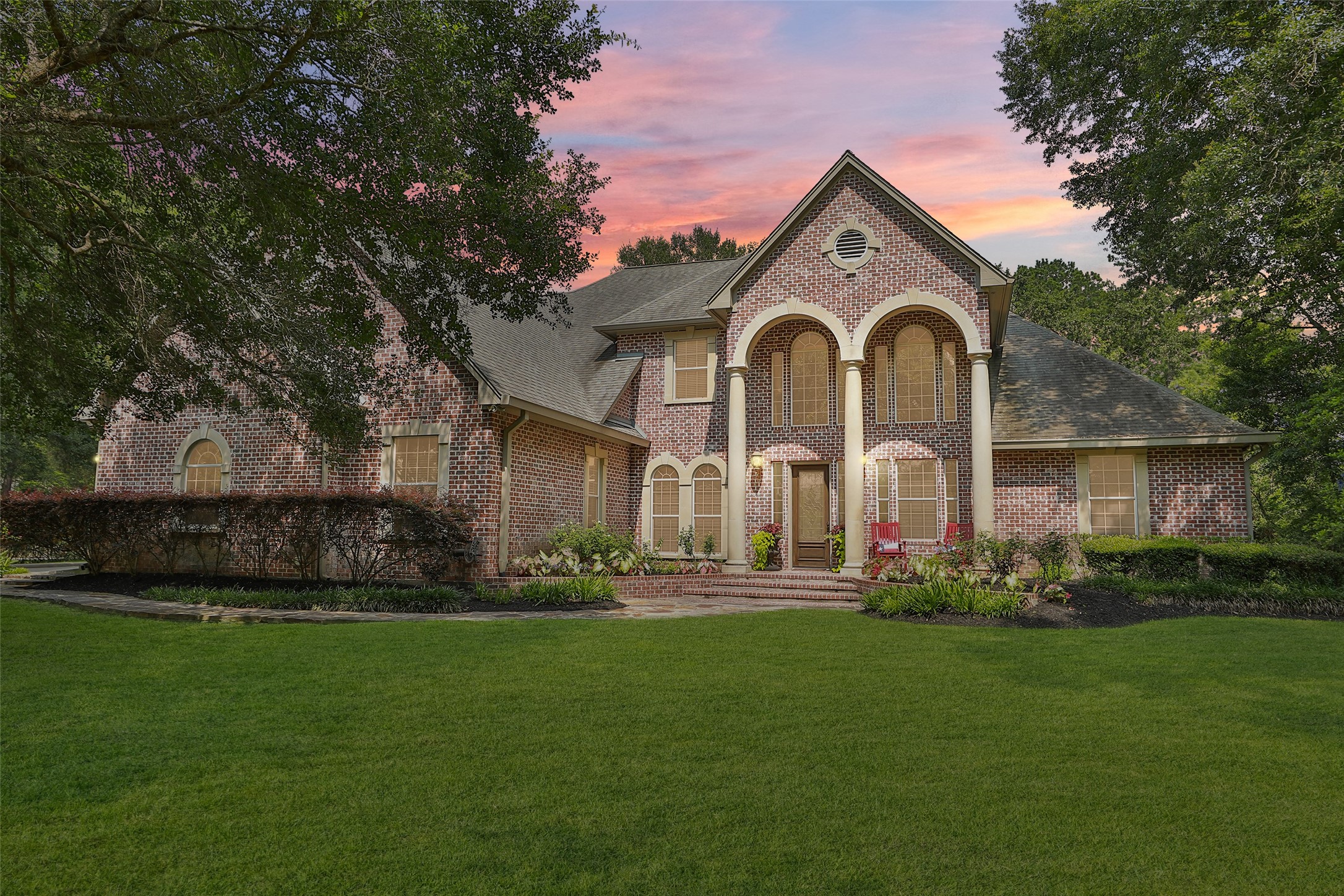 12126 Zion Road Tomball, TX 77375 - Photo 2 of 45 a front view of a house with a garden