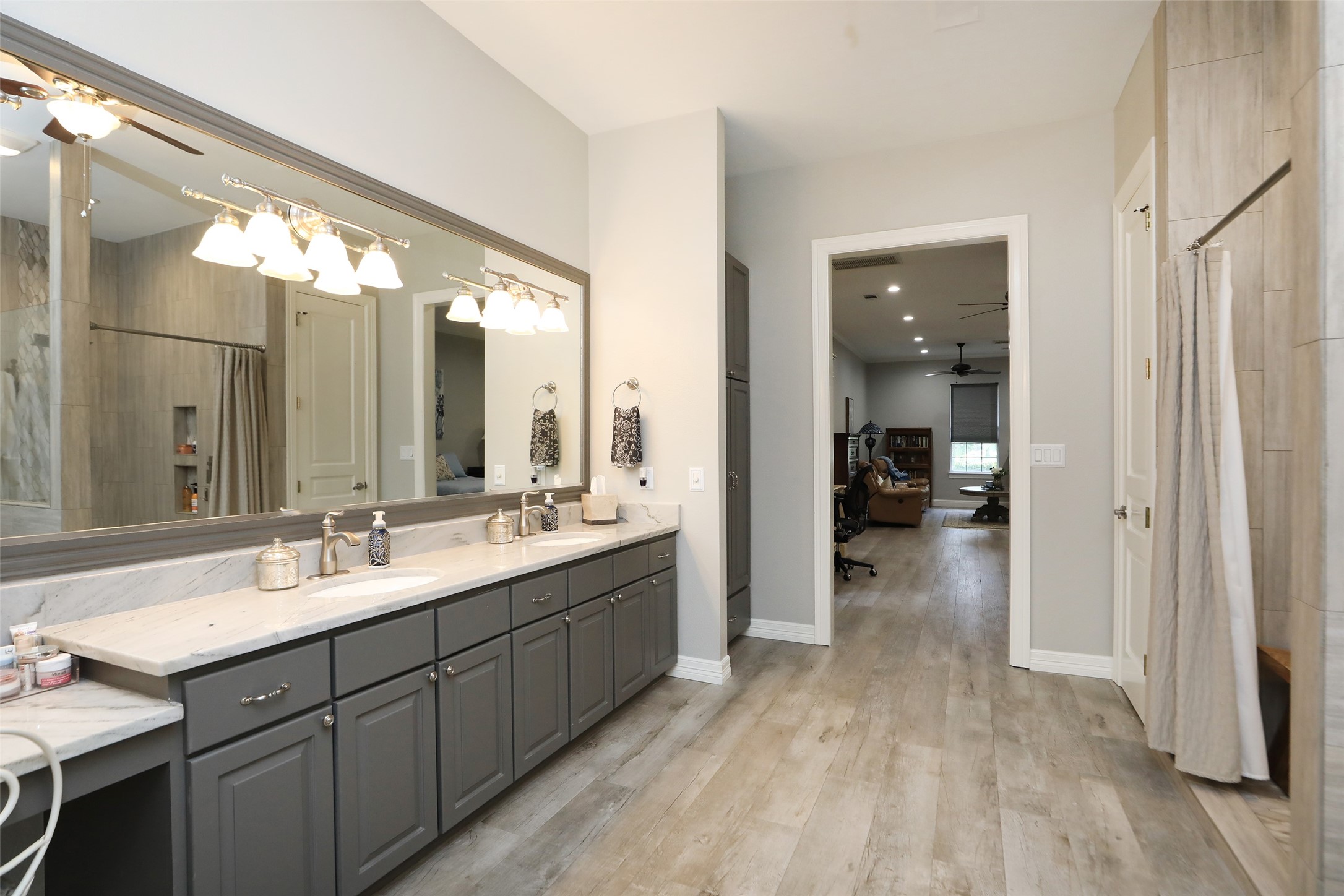 12126 Zion Road Tomball, TX 77375 - Photo 24 of 45 a spacious bathroom with a double vanity sink and a mirror