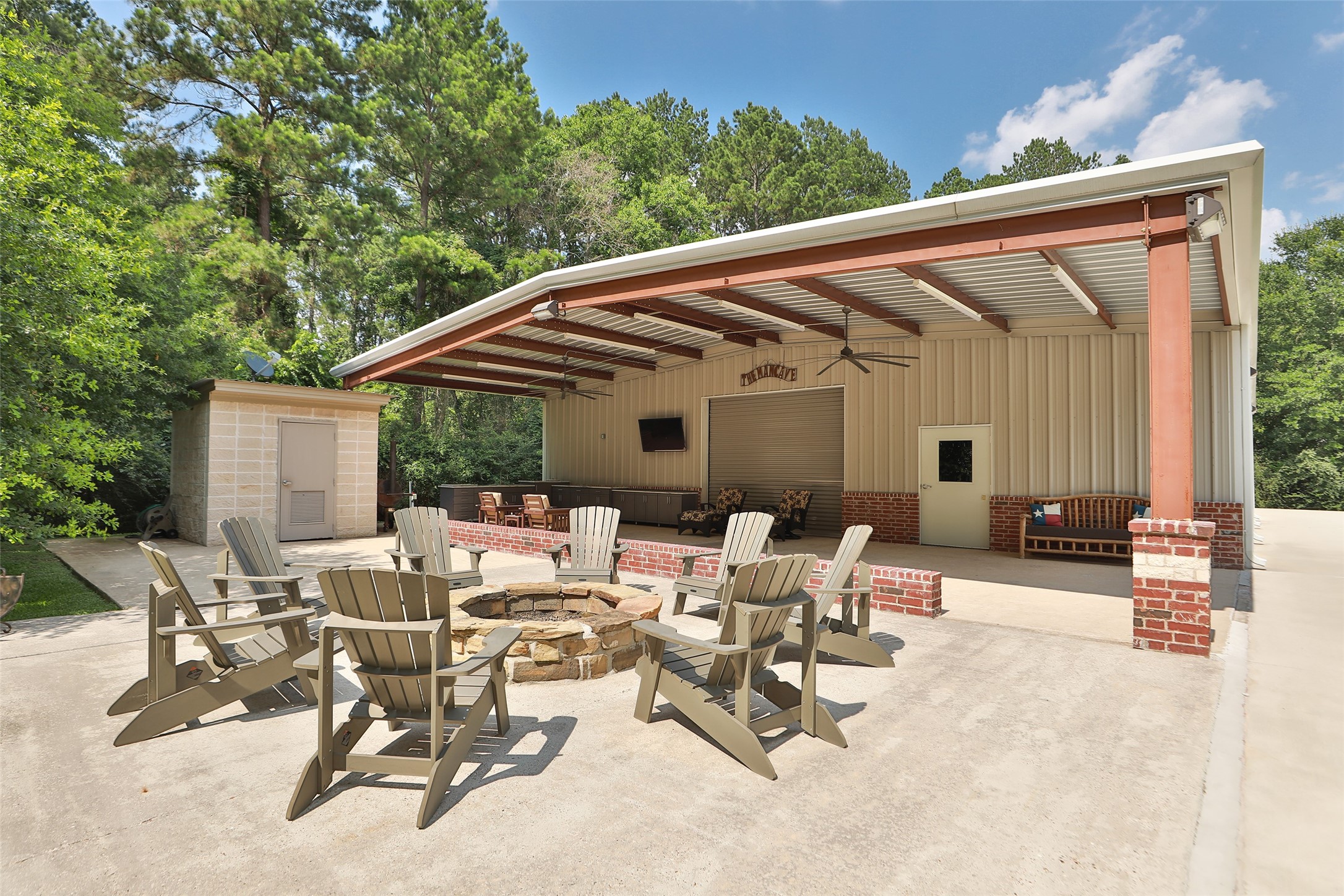 12126 Zion Road Tomball, TX 77375 - Photo 33 of 45 a view of a patio with table and chairs and floor to ceiling window