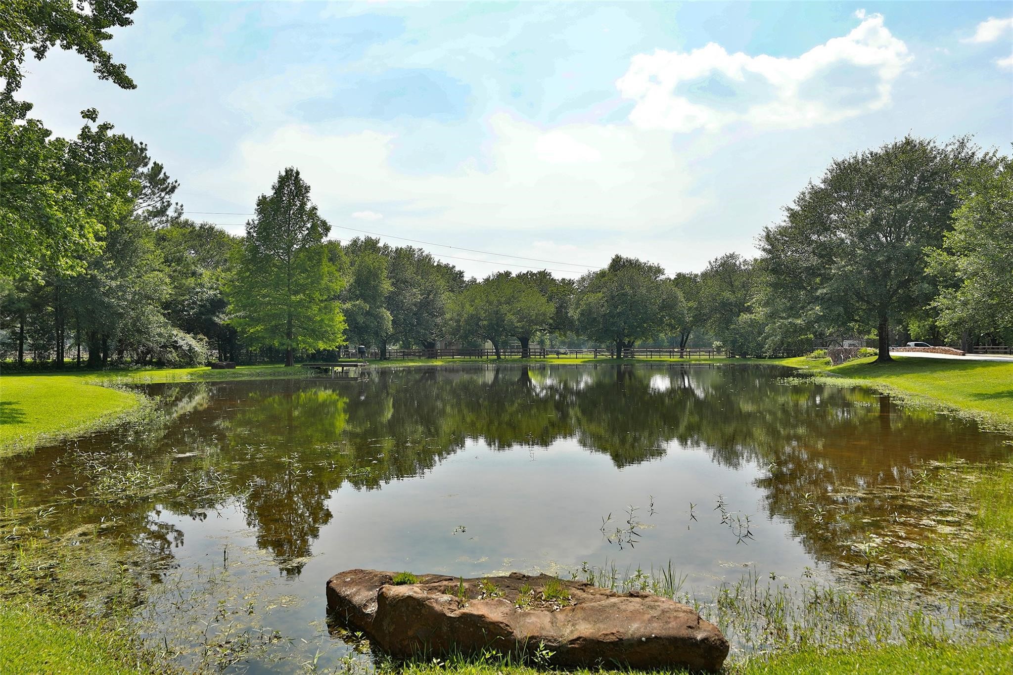 12126 Zion Road Tomball, TX 77375 - Photo 38 of 45 a view of a lake with houses