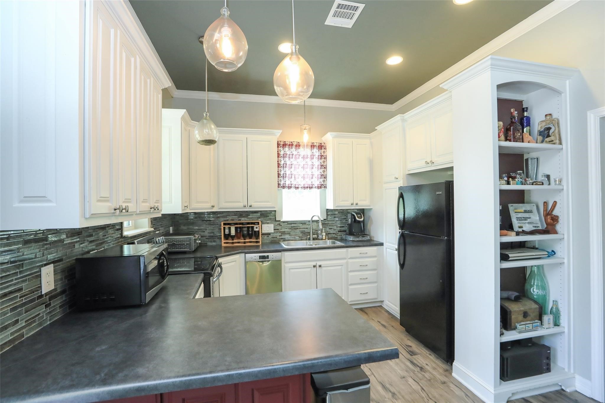 12126 Zion Road Tomball, TX 77375 - Photo 45 of 45 a kitchen with stainless steel appliances granite countertop a stove refrigerator a oven and a refrigerator