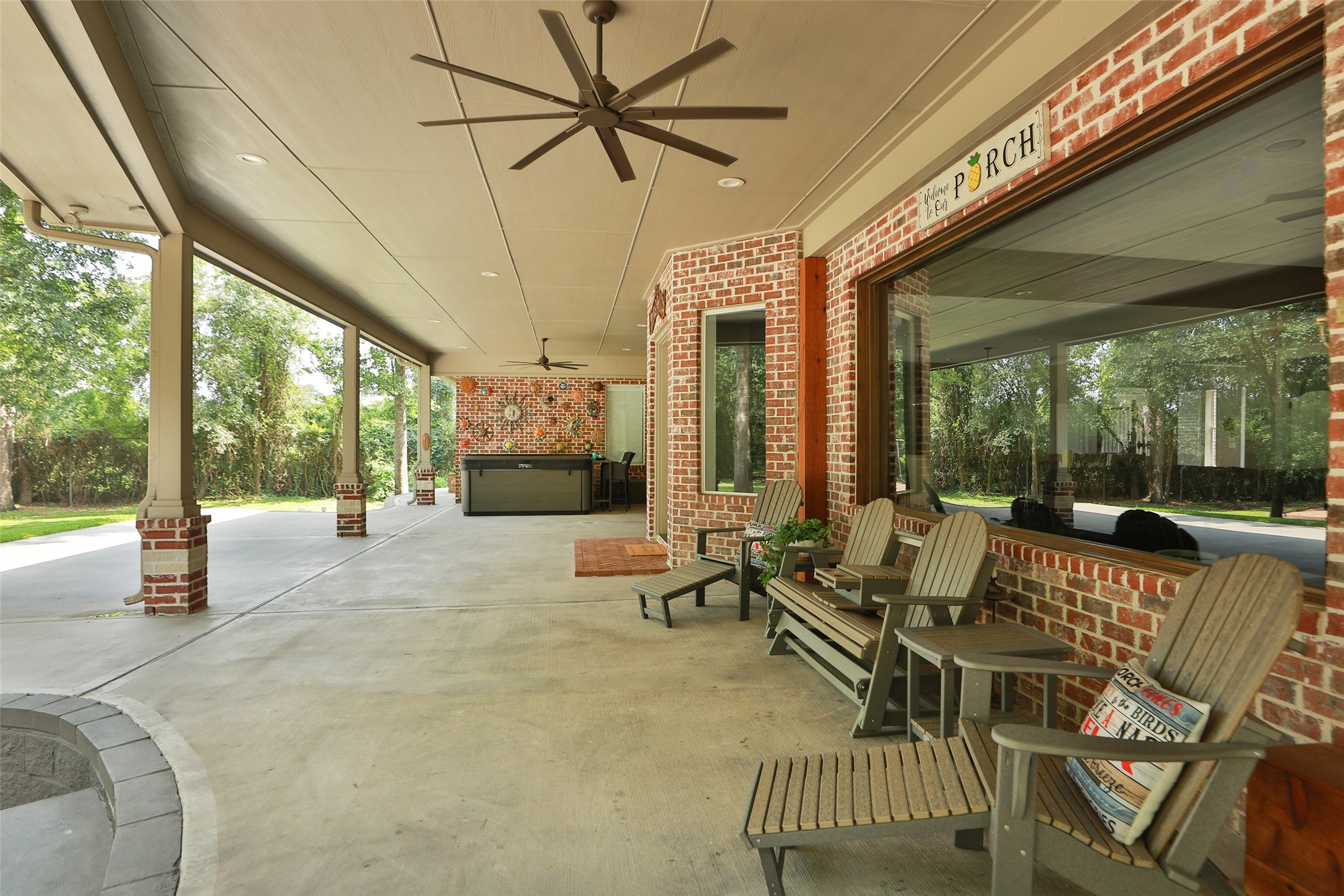 12126 Zion Road Tomball, TX 77375 - Photo 10 of 45 a living room with patio furniture and a floor to ceiling window