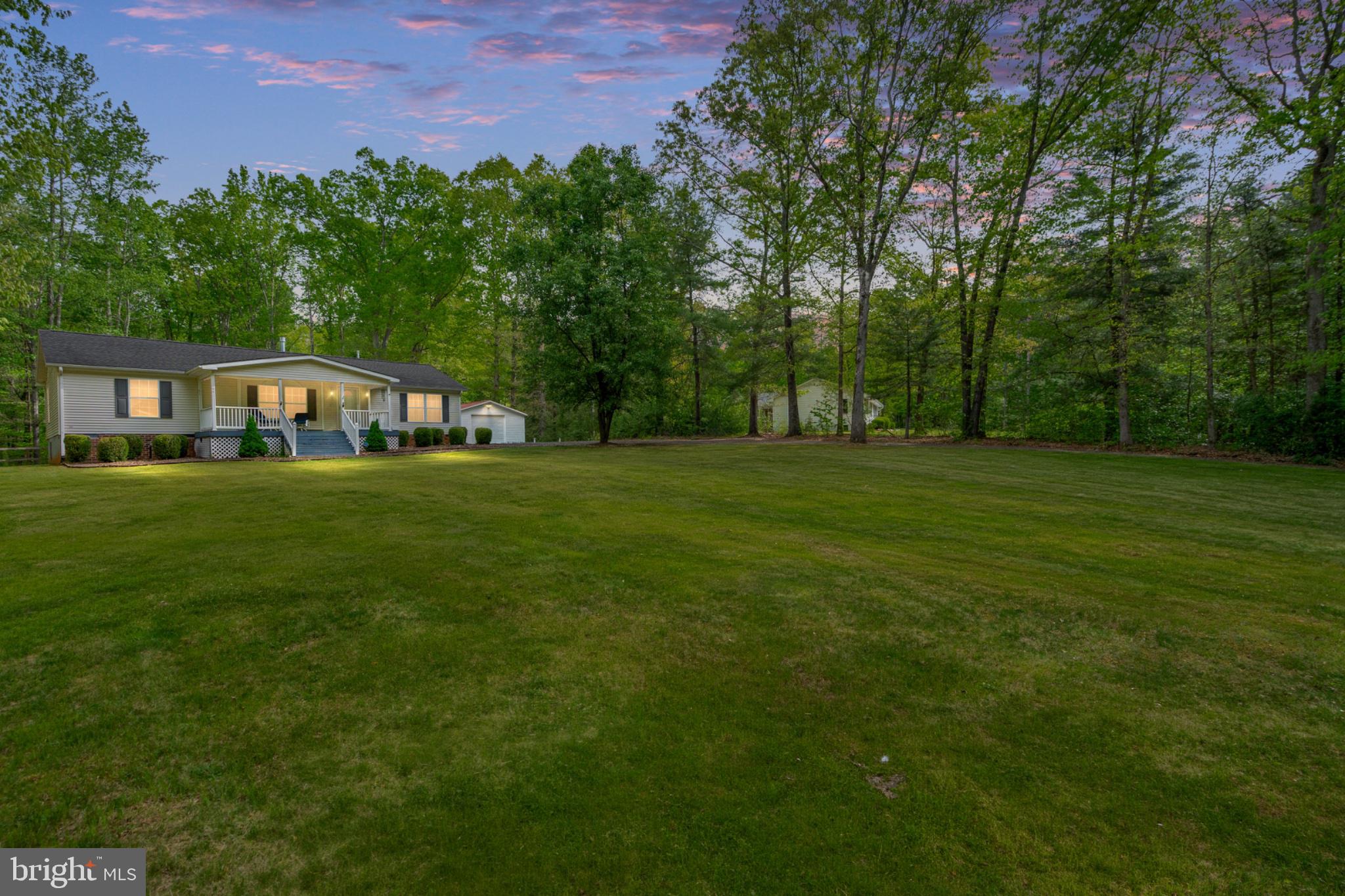 2319 Sizer Road Beaverdam, VA 23015 - Photo 3 of 61 Serene home nestled in lush greenery.