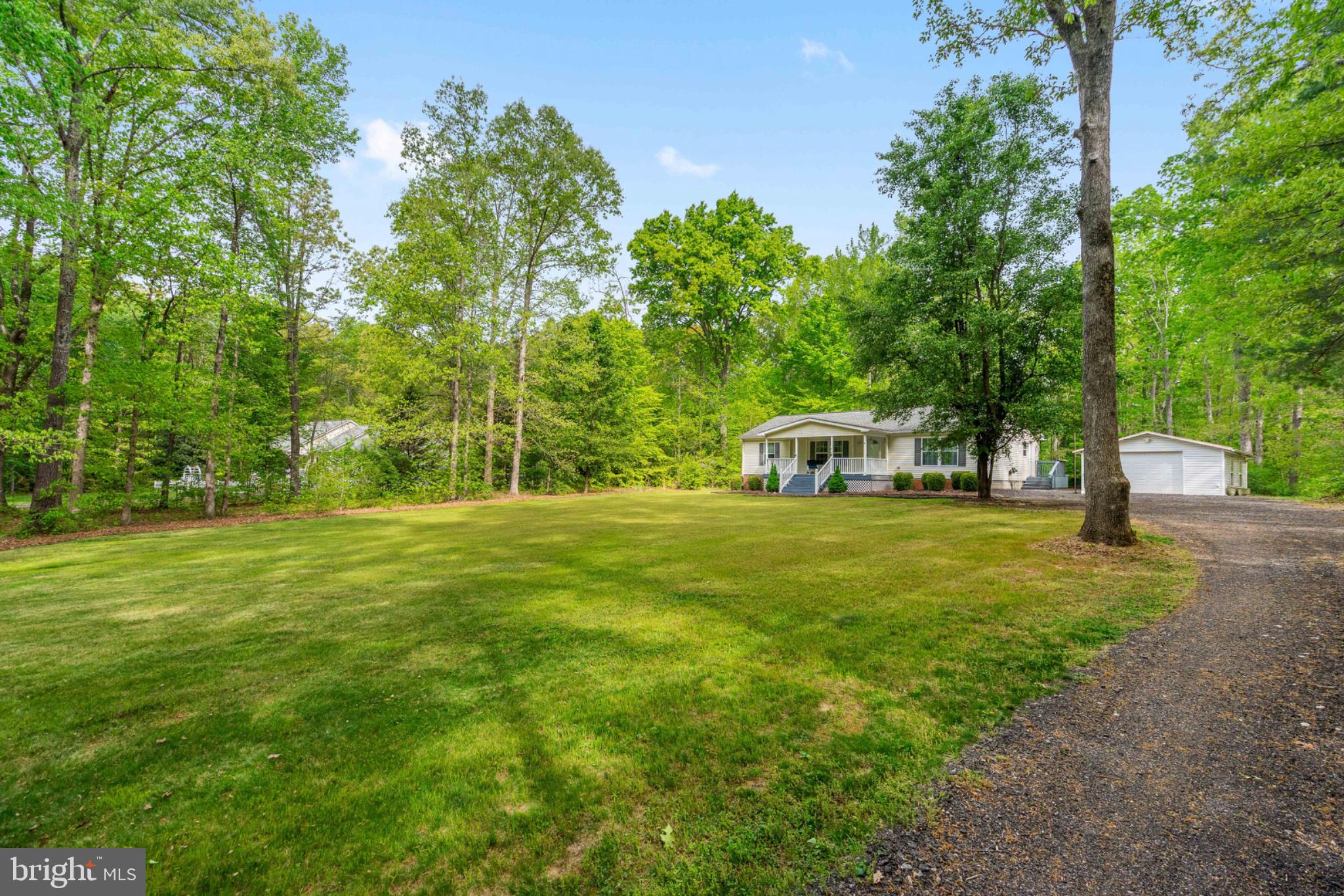2319 Sizer Road Beaverdam, VA 23015 - Photo 5 of 61 Serene home nestled in lush greenery.
