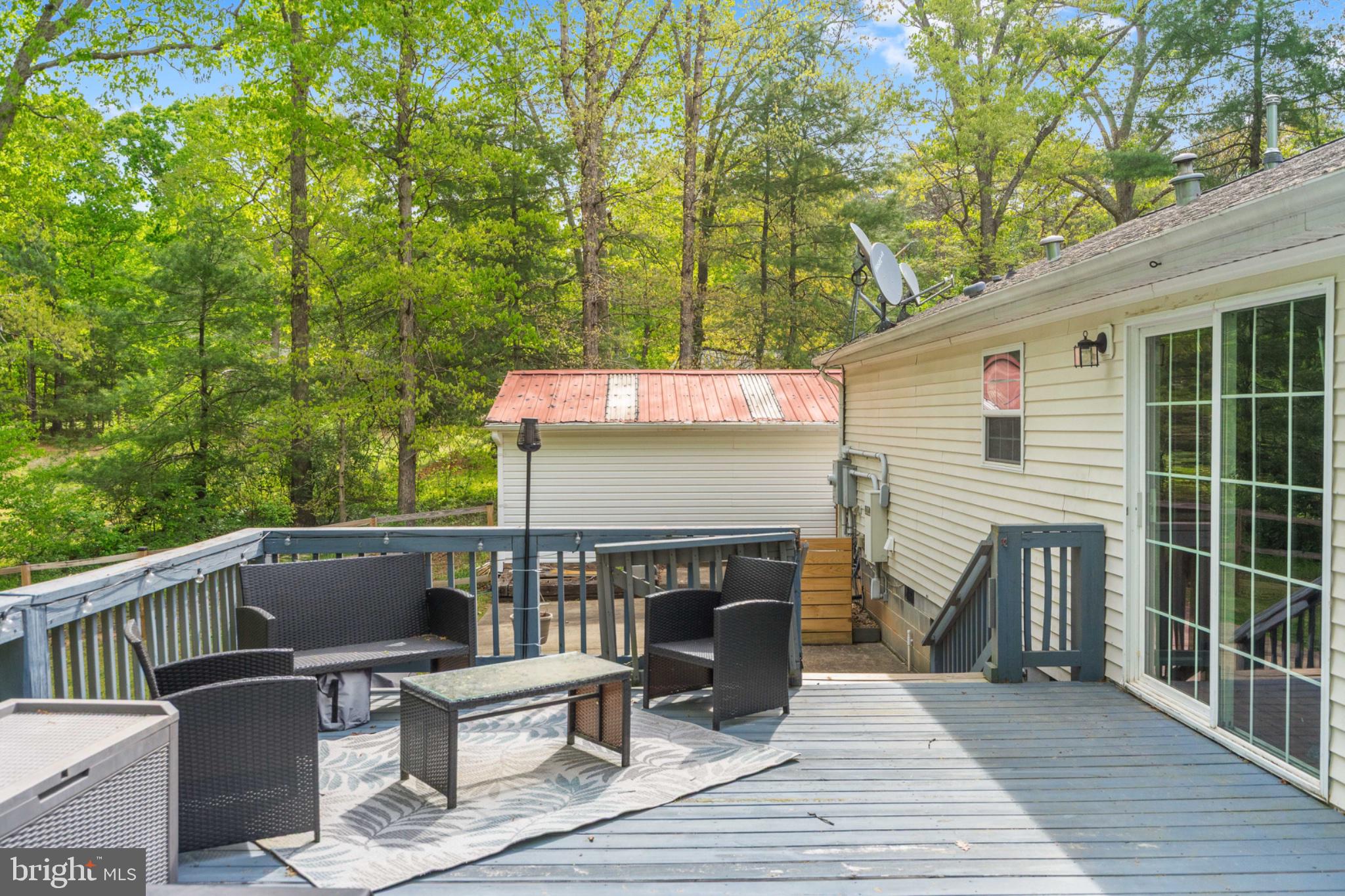 2319 Sizer Road Beaverdam, VA 23015 - Photo 52 of 61 Serene deck nestled in nature's embrace.