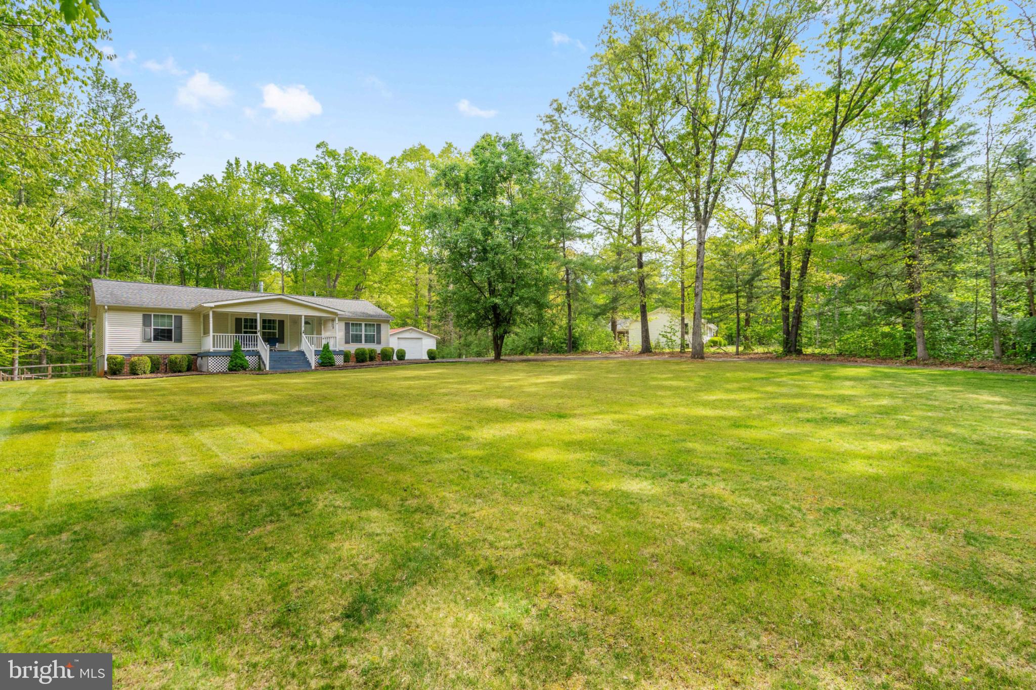 2319 Sizer Road Beaverdam, VA 23015 - Photo 8 of 61 Serene home nestled in lush greenery.