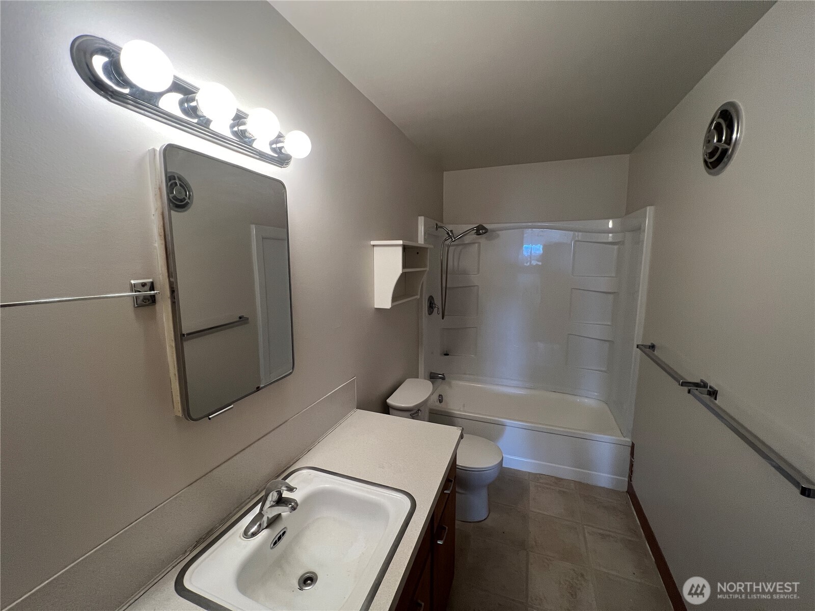 1505 East Galer Street, Unit 3 Seattle, WA 98112 - Photo 8 of 9 a bathroom with a sink toilet and shower