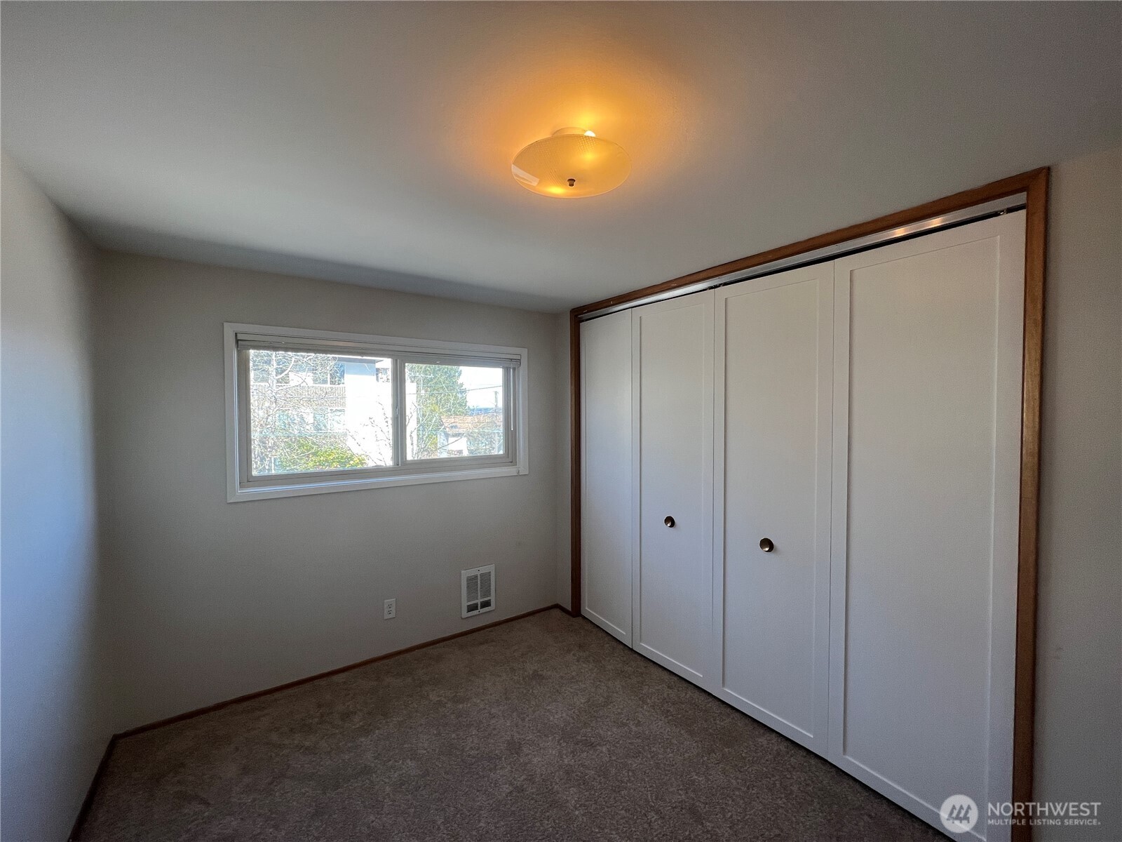 1505 East Galer Street, Unit 3 Seattle, WA 98112 - Photo 9 of 9 a view of an empty room with a window